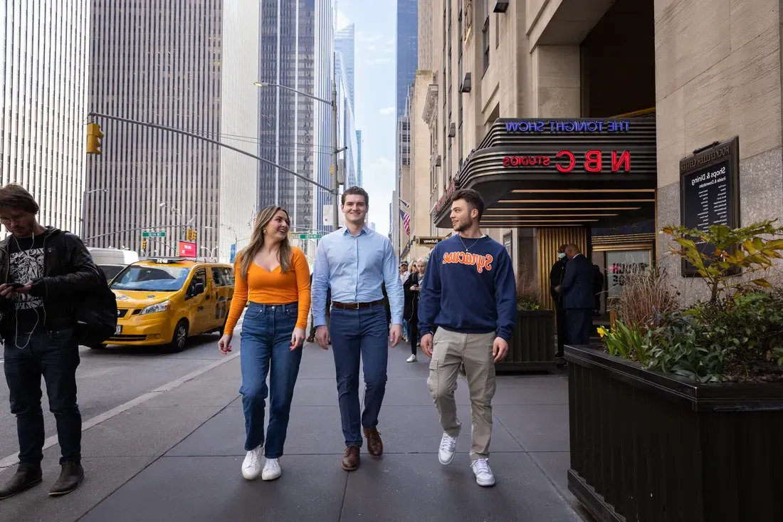 People walking down the street in New York City.